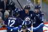 John Woods / WINNIPEG FREE PRESS FILES
Drew Stafford, Blake Wheeler and Mark Scheifele celebrate a Wheeler goal in front of the hometown fans.