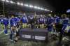 The Winnipeg Blue Bombers gather around the West division trophy after beating Saskatchewan on Sunday. (Daniel Crump / Winnipeg Free Press)