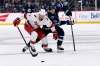 Winnipeg Jets' Mark Scheifele and Carolina Hurricanes&rsquo; Brendan Smith compete for a loose puck during the second period of the 4-2 Carolina win in Winnipeg on Tuesday. THE CANADIAN PRESS/Fred Greenslade