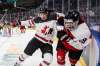 THE CANADIAN PRESS FILES/Jason Franson
Canada's Carson Lambos checks Austria's Marco Kasper during third period IIHF World Junior Hockey Championship action in Edmonton on Tuesday, December 28, 2021.