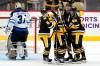 Pittsburgh Penguins' Kasperi Kapanen (42) celebrates his goal with teammates as Winnipeg Jets goaltender Connor Hellebuyck (37) collects himself during the third period of an NHL hockey game in Pittsburgh, Sunday, Jan. 23, 2022. The Penguins won in a shootout 3-2. (AP Photo/Gene J. Puskar)