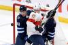 Fred Greenslade / THE CANADIAN PRESS
Winnipeg Jets’ Nate Schmidt and Florida Panthers’ Sam Bennett fight for position in front of the Winnipeg net during the first period of the Panthers 5-3 in Winnipeg on Tuesday.