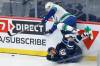 Vancouver Canucks’ Alex Chiasson jumps over Winnipeg Jets’ Nate Schmidt during the first period. THE CANADIAN PRESS/John Woods
