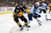 Pittsburgh Penguins’ Evgeni Malkin controls the puck with Winnipeg Jets’ Mark Scheifele defending during an NHL hockey game in Pittsburgh, Sunday, Jan. 23, 2022. (AP Photo/Gene J. Puskar)