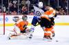 Philadelphia Flyers goaltender Carter Hart, left, looks to make a save as he Flyers’ Ivan Provorov (9) and Justin Braun and Winnipeg Jets’ Adam Lowry work in front of him during the first period Tuesday in Philadelphia. (AP Photo/Derik Hamilton)