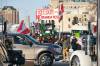 Protesters continue to block the entrance to the Manitoba Legislative building on Broadway early Monday morning. (Mike Deal / Winnipeg Free Press)