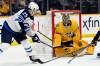 Predators goaltender Juuse Saros stops a shot by Winnipeg Jets centre Paul Stastny during first-period action Saturday in Nashville, Tenn. (Mark Zaleski / The Associated Press files)