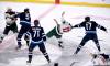 Minnesota Wild’s Jordan Greenway and Marcus Foligno fight Winnipeg Jets’ Brenden Dillon and Adam Lowry during the first period of NHL action in Winnipeg.