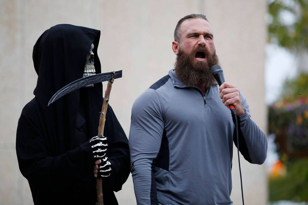 JOHN WOODS / FREE PRESS FILESShaun Zimmer, with the grim reaper, at a protest last September in Winnipeg. He told his social-media followers that his bank froze his funds.