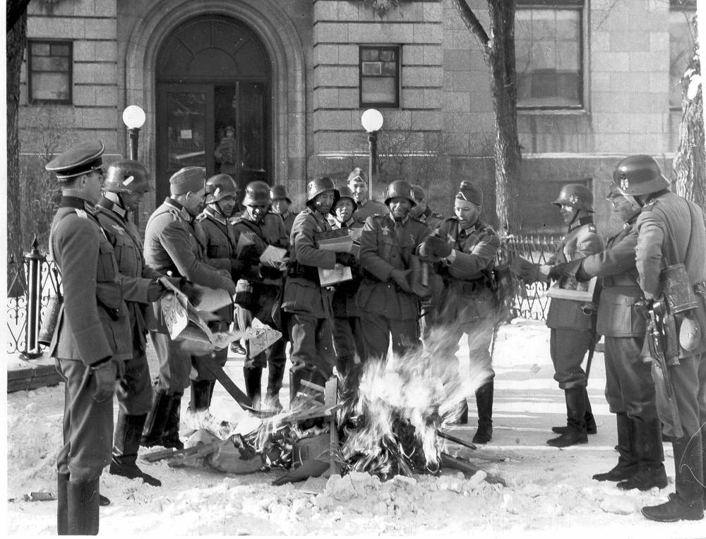 Mock Nazi troops burn books on If Day. (Winnipeg Free Press files)
