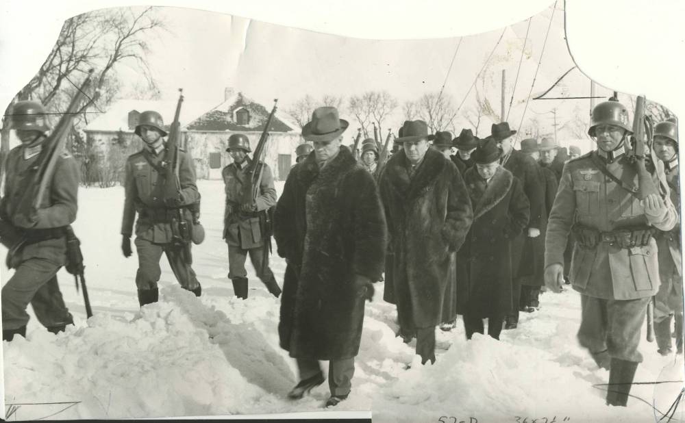 Mock Nazi stormtroopers take Manitoba premier John Bracken, Errick Wills and other members of the cabinet and civic officials on their way to cells at Lower Fort Garry. (Winnipeg Free Press files)