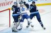 JOHN WOODS / THE CANADIAN PRESS FILESAdam Brooks (centre) is now a teammate of Connor Hellebuyck and Logan Stanley after the Jets claimed him off waivers.