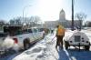 MIKE DEAL / WINNIPEG FREE PRESS Protestors pack up and move their vehicles away from the Memorial Boulevard location across from the Manitoba Legislative building Wednesday morning. Some of the protestors have been moving gear over to Memorial Park where they plan on setting up tents, a stage and a large tipi. 220223 - Wednesday, February 23, 2022.