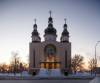 MIKE DEAL / WINNIPEG FREE PRESS Pre-dawn light illuminates the Ukrainian-Orthodox Holy Trinity church at 1175 Main Street on Thursday, February 24. Many Winnipeggers with family and friends in Ukraine spent a restless and possibly sleepless night as reports that Russia had started their invasion of Ukraine. 220224 - Thursday, February 24, 2022.