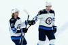 Kyle Connor (left) and Evgeny Svechnikov celebrate one of Connor's goals. He notched a pair Sunday afternoon in Phoenix to give him 32 on the season, while Svehcnikov added his fifth. (Ross D. Franklin / The Associated Press)