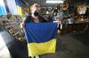 RUTH BONNEVILLE / WINNIPEG FREE PRESS 
Nadia Zeleniuk and her husband Ruslan, owners of Ukrainian Import and Export on Selkirk Ave., sell out of flags. Nadia Zeleniuk and many of her friends are sewing homemade flags during their off work time with donated material to keep up with the demand. Money raised is going to help out Ukrainians.