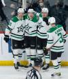 Dallas Stars players celebrate Jason Robertson’s goal against the Winnipeg Jets during the second period. THE CANADIAN PRESS/John Woods