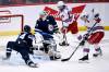 Winnipeg Jets’ Josh Morrissey (44) stops the puck from getting past goaltender Connor Hellebuyck (37) on a shot by New York Rangers’ Jacob Trouba (8) during the second period of NHL action in Winnipeg, Sunday, March 6, 2022. THE CANADIAN PRESS/Fred Greenslade