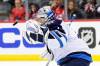 Winnipeg Jets goaltender Eric Comrie stops a shot by the New Jersey Devils during the first period Thursday, in Newark. (AP Photo/Eduardo Munoz Alvarez)
