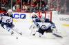 Eduardo Munoz Alvarez / The Associated Press
Winnipeg Jets goaltender Eric Comrie keeps an eye on the puck after a save during the third period of the Jets 2-1 win over the New Jersey Devils Thursday.
