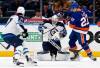 Anders Lee and his Islanders teammates had a field day Friday night making life miserable for Jets goaltender Connor Hellebuyck. (Jim McIsaac / The Associated Press)