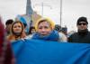 JESSICA LEE / WINNIPEG FREE PRESS
Joy Stewart Wiwchar holds a Ukrainian flag near the Canadian Museum for Human Rights Thursday during a protest that called for an end to the Russian invasion of Ukraine.