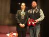 Métis National Council president Cassidy Caron wears her new beaded jacket with Mitchell Case, showing the red moccasins for the Pope. (John Longhurst / Winnipeg Free Press)