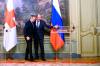 Red Cross representive Peter Maurer, left, and Russian Foreign Minister Sergey Lavrov in Moscow on Thursday.
(Associated Press)