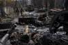 RODRIGO ABD / ASSOCIATED PRESS PHOTO
Soldiers walk amid destroyed Russian tanks in Bucha, on the outskirts of Kyiv, Ukraine.