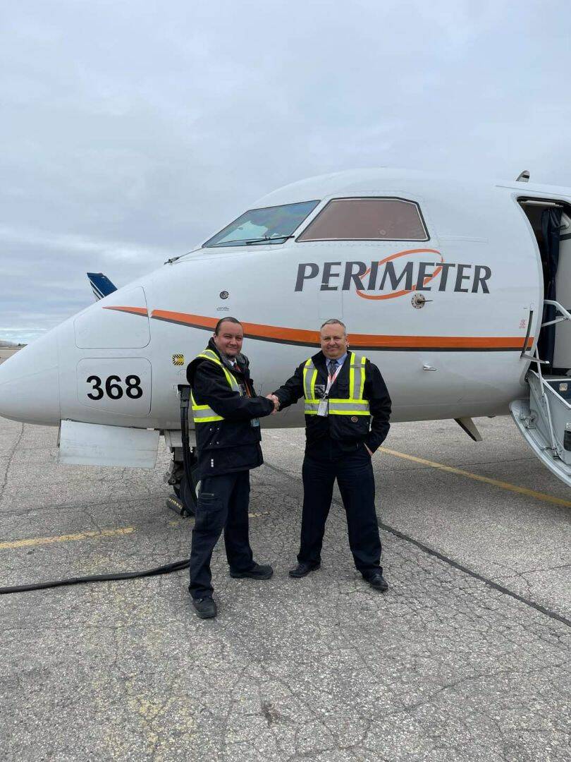 Tik Mason and Richard Mlton, chief pilot at Perimeter Aviation. (Supplied)