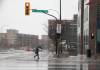 JESSICA LEE / WINNIPEG FREE PRESS
A pedestrian crosses the street in the rain on Portage Ave. on Friday. Forecasters say 30 to 50 millimetres of precipitation is expected over the weekend with the heaviest amounts to fall Saturday.