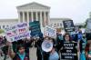 Demonstrators protest outside of the U.S. Supreme Court in Washington last week. A draft opinion suggests the U.S. Supreme Court could be poised to overturn the landmark 1973 Roe v. Wade case that legalized abortion nationwide, according to a Politico report. (Jose Luis Magana / The Associated Press Files)