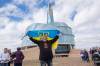 MIKE SUDOMA / WINNIPEG FREE PRESS
Ukraine supporter, Norbert Iwan, fliesa Ukraine Flag in front of the Canadian Museum for Human Rights after a March for Ukraine event. The march had around 300 supporters and went from the Manitoba Legislate Building to the Canadian Museum for Human Rights.