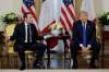 Evan Vucci / The Associated Press
French President Emmanuel Macron meets with U.S. President Donald Trump at Winfield House in London on Tuesday.