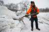 JOHN WOODS / WINNIPEG FREE PRESS
Brad Hignell and another resident shovelled the ice from a pedestrian bridge that crosses Omand’s Creek after the City of Winnipeg closed it to pedestrians.