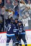 John Woods / The Canadian Press
Winnipeg Jets&rsquo; Adam Lowry (from left) celebrates Andrew Copp&rsquo;s game-winning goal last month with Mathieu Perreault.