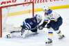 JOHN WOODS / THE CANADIAN PRESS FILES
St. Louis Blues forward David Perron scores the game-winning goal in overtime against Jets goaltender Connor Hellebuyck at Bell MTS Place on Friday.