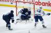 THE CANADIAN PRESS/John Woods
Toronto Maple Leafs' Kasperi Kapanen scores on Winnipeg Jets goaltender Connor Hellebuyck after Luca Sbisa turned over the puck in his own end during the first period in Winnipeg on Thursday.