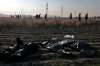 (AP Photo/Ebrahim Noroozi)
Rescue workers search the scene where a Ukrainian plane crashed as the bodies of victims in body bags lie on the ground, in Shahedshahr, southwest of the capital Tehran, Iran, Wednesday. A Ukrainian airplane with more than 170 people crashed on Wednesday shortly after takeoff from Tehran's main airport, killing all onboard.