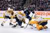 Winnipeg Jets' Blake Wheeler (26) gets a shot on Nashville Predators goaltender Juuse Saros (74) as his teammates Yannick Weber (7) and Roman Josi (59) defend during second period NHL action in Winnipeg on Sunday. (Fred Greenslade / The Canadian Press)