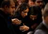 JOHN WOODS / WINNIPEG FREE PRESS
The sister (centre) of victim Bahareh Haj Esfandiari is comforted Sunday at a memorial at the Caboto Centre for Manitoba victims killed when their flight was shot down in Iran.