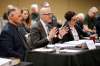 Winnipeg Police Association president Moe Sabourin (left) listens as lawyer Keith LaBossiere tells an arbitrator it is asking for such damages because of the campaign to undermine its pension and union in the eyes of the public. (John Woods / Winnipeg Free Press)