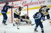 During his 500th game Friday night, Winnipeg Jets' Mark Scheifele (55) celebrated as Patrik Laine (29) scored on Boston Bruins goaltender Tuukka Rask (40) as Charlie McAvoy (73) and Patrice Bergeron (37) defend. (John Woods / The Canadian Press)
