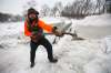 Brad Hignell and a friend used spades and picks to clear the ice over the course of a mid-December Saturday morning. (John Woods / Free Press files)