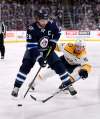 Blake Wheeler says it has been tough playing without his friend Dustin Byfuglien. (Fred Greenslade / The Canadian Press files)