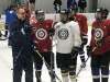 mike mcintyre / winnipeg free press
Winnipeg Jets head coach Paul Maurice gives some instruction to Sandy Bay Badgers players Monday afternoon following a Jets workout.
