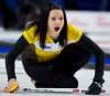 Team Manitoba skip Kerri Einarson bosses her sweepers during the 1-vs.-2 Page playoff at the Scotties Tournament of Hearts Saturday in Moose Jaw. (Jonathan Hayward / The Canadian Press)