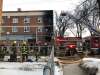 Firefighters were dispatched to the scene of a fire at Sargent Avenue and Beverley Street shortly before 6 a.m. Monday morning.  Two people were sent to hospital, with one in critical condition, and other residents now need to find accommodations in the midst of the COVID-19 pandemic. (Maggie Macintosh / Winnipeg Free Press)