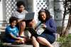 JOHN WOODS / WINNIPEG FREE PRESS
Zilla Jones sits on her front steps as her children Kamil, 9, left, and Jericho, 12, read school books. Jones, who is a full-time lawyer, says two months into the distance learning routine, parents are getting exhausted as they try to balance work and homeschool. (John Woods / Winnipeg Free Press)