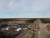 The blockade at the northern access road to Manitoba Hydro's Keeyask worksite is seen from a drone-mounted camera on Wednesday evening, moments before the RCMP arrived to formally present an injunction ordering them to clear both blockade sites. (Supplied photo)